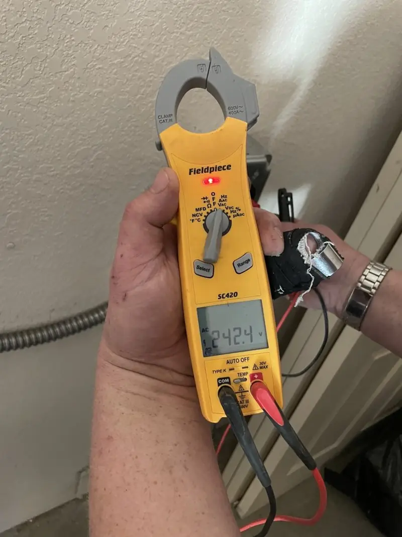 Voltage testing with clamp meter during Generator Installation in Athens